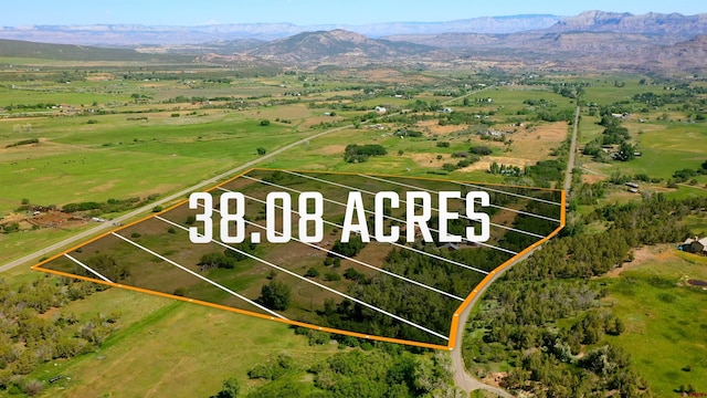9359 49 1/4 Rd, Mesa, CO 81643 - aerial view of sparsely populated area featuring property boundaries highlighted and a mountainous background