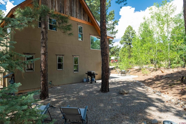 15 Edgemont Way, Durango, CO 81301 - view of property exterior with stucco siding and a patio