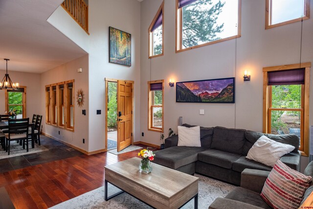 15 Edgemont Way, Durango, CO 81301 - living room with a high ceiling, a chandelier, and dark wood-type flooring
