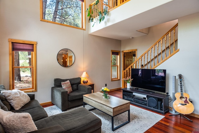 15 Edgemont Way, Durango, CO 81301 - living room featuring stairs, wood finished floors, and a towering ceiling