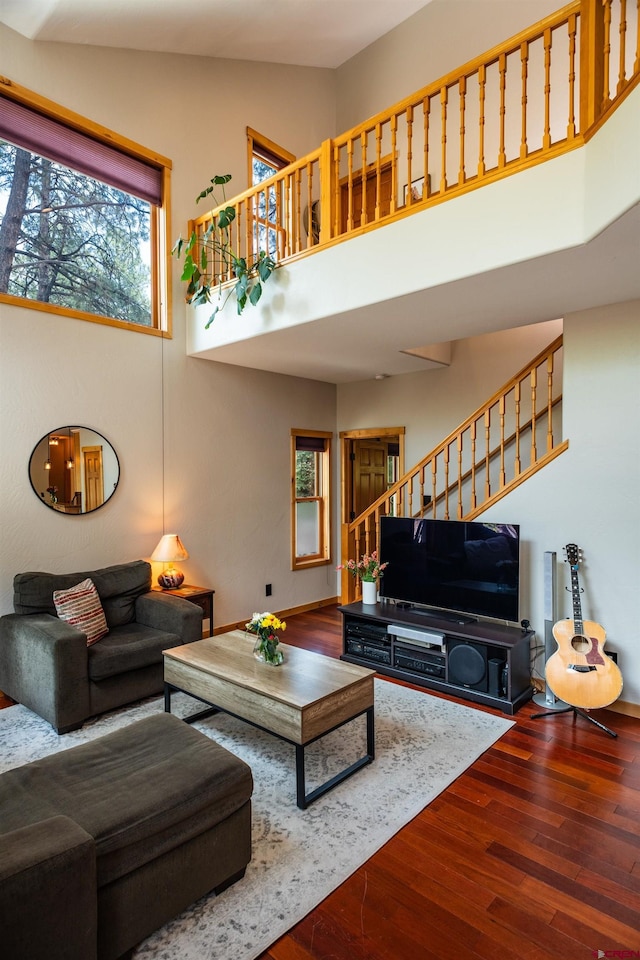 15 Edgemont Way, Durango, CO 81301 - living room featuring stairs, wood finished floors, and a towering ceiling