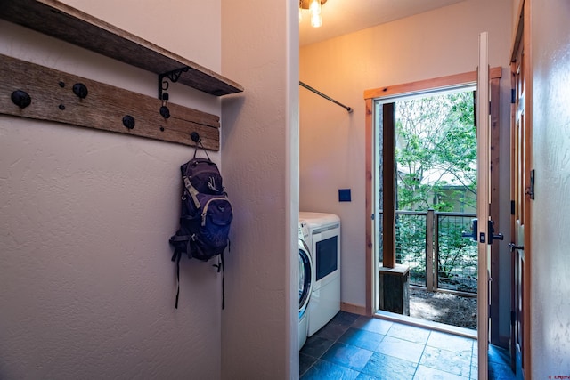 15 Edgemont Way, Durango, CO 81301 - washroom featuring washing machine and dryer and stone tile flooring
