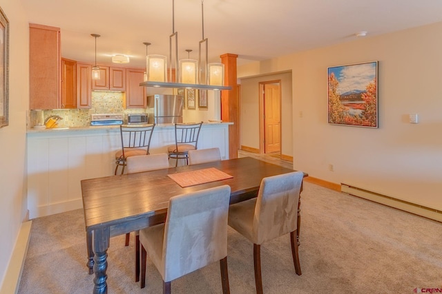 20 Hunter Hill Rd Unit 110, Mount Crested Butte, CO 81225 - dining room featuring a baseboard heating unit and light colored carpet