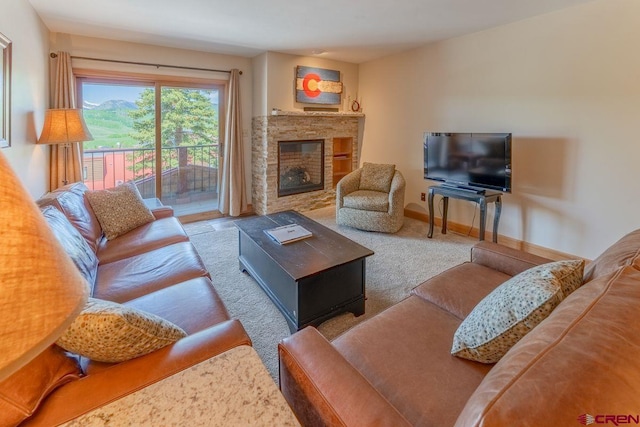 20 Hunter Hill Rd Unit 110, Mount Crested Butte, CO 81225 - carpeted living area with a stone fireplace and baseboards