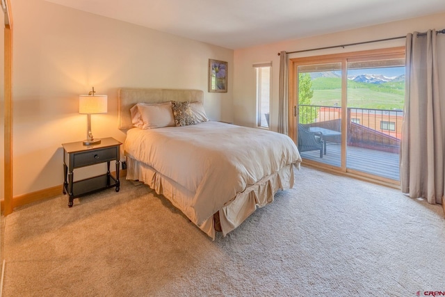 20 Hunter Hill Rd Unit 110, Mount Crested Butte, CO 81225 - bedroom with access to exterior and light carpet