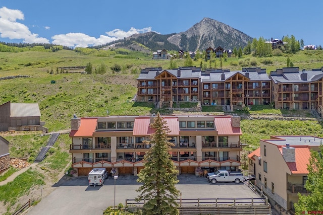 20 Hunter Hill Rd Unit 110, Mount Crested Butte, CO 81225 - view of property with a mountain view and uncovered parking