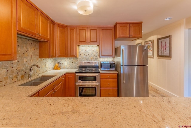 20 Hunter Hill Rd Unit 110, Mount Crested Butte, CO 81225 - kitchen with stainless steel appliances, wood finished floors, tasteful backsplash, and light stone counters
