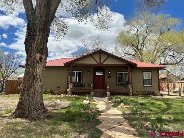 115 S Linden, Cortez, CO 81321 - view of front of property featuring covered porch and a metal roof