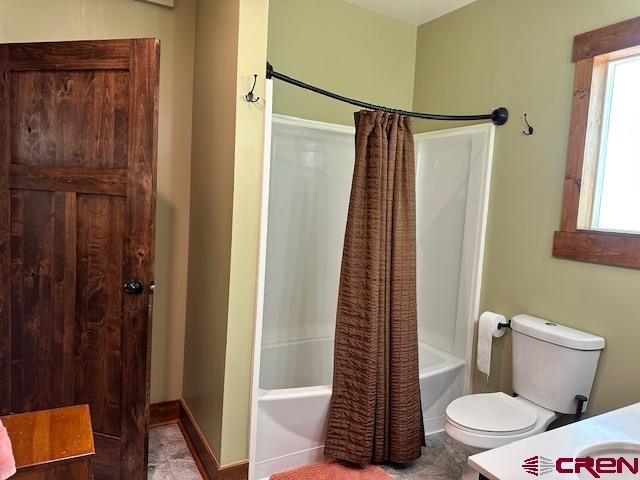115 S Linden, Cortez, CO 81321 - bathroom featuring shower / bathtub combination with curtain and vanity