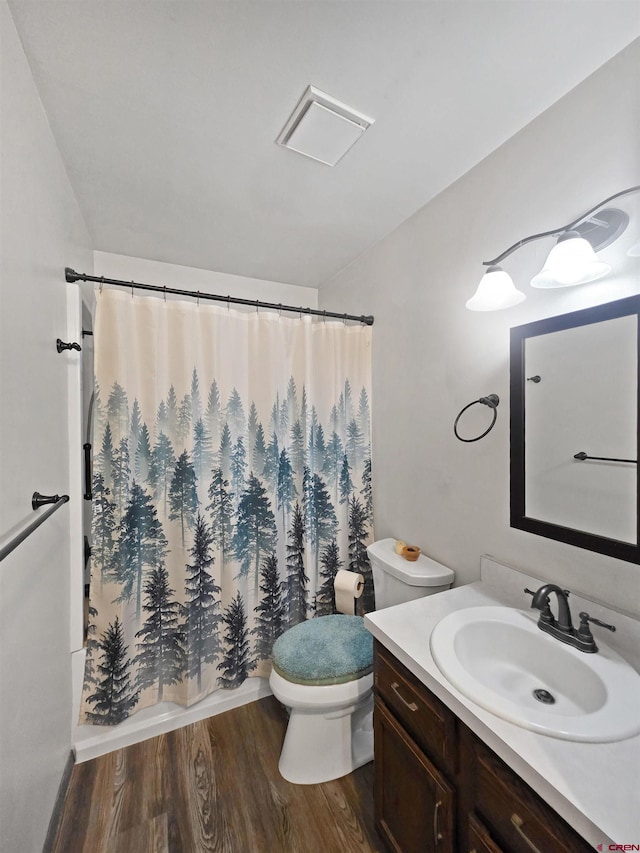 613 N Colorado St, Cortez, CO 81321 - full bathroom featuring vanity and wood finished floors