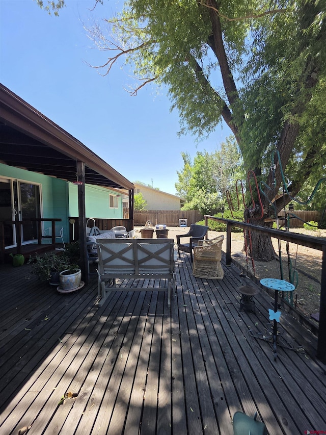 613 N Colorado St, Cortez, CO 81321 - wooden deck with an outdoor hangout area and a fenced backyard