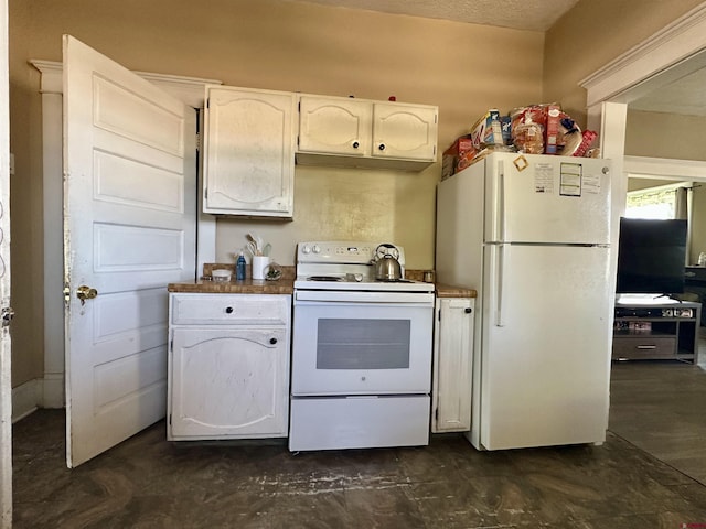 18551 F Rd, Delta, CO 81416 - kitchen featuring white appliances, white cabinets, and under cabinet range hood