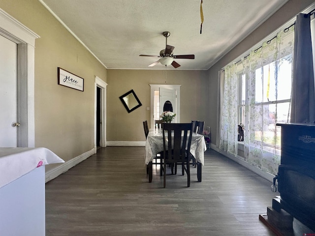 18551 F Rd, Delta, CO 81416 - dining area with a ceiling fan, a textured ceiling, dark wood-style flooring, and crown molding