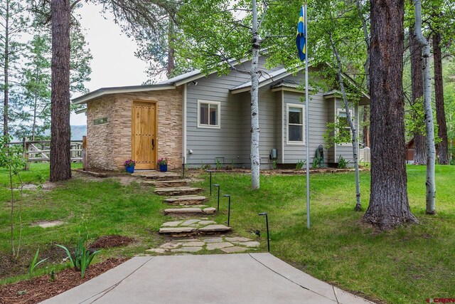234 Wapiti Dr, Bayfield, CO 81122 - view of front of home featuring stone siding