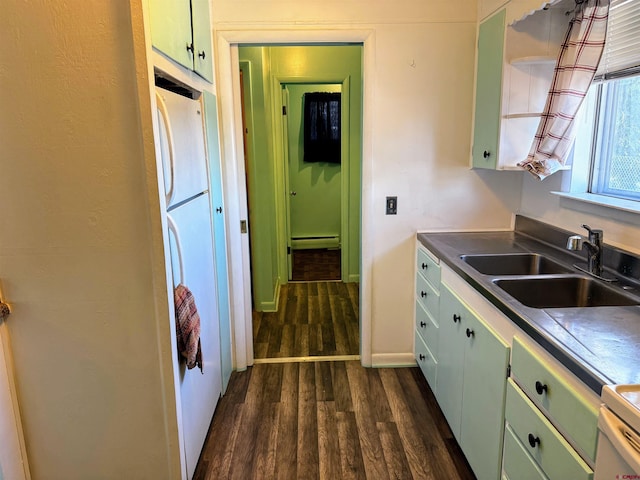 20114 Austin Rd, Austin, CO 81410 - kitchen with green cabinets, dark wood-style floors, a baseboard radiator, and stove