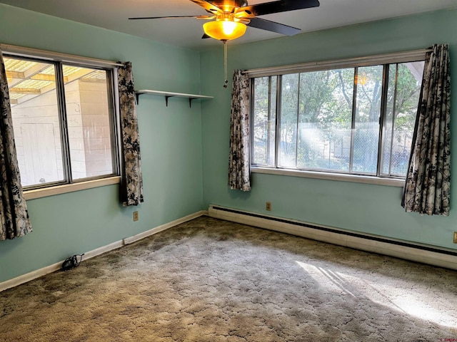 20114 Austin Rd, Austin, CO 81410 - carpeted empty room with a baseboard heating unit and a ceiling fan