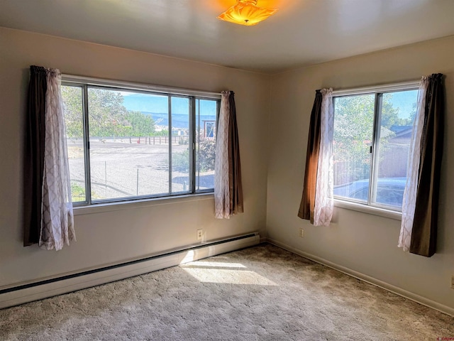 20114 Austin Rd, Austin, CO 81410 - carpeted spare room with a baseboard heating unit and healthy amount of natural light