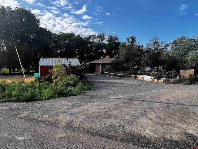 20114 Austin Rd, Austin, CO 81410 - view of front of property featuring view of wooded area and driveway
