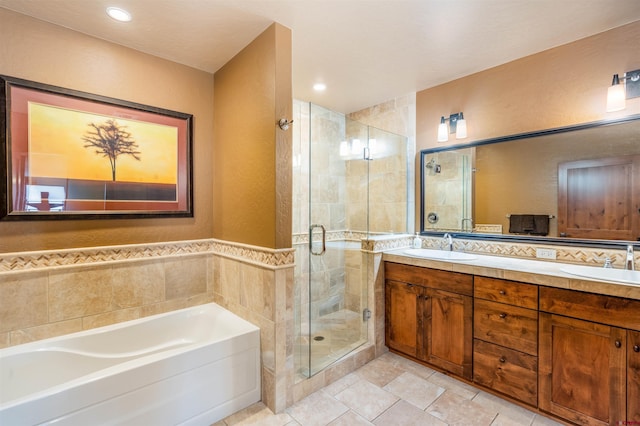 24 Sheol St Unit 202, Durango, CO 81301 - bathroom featuring a garden tub, a stall shower, double vanity, and a textured wall