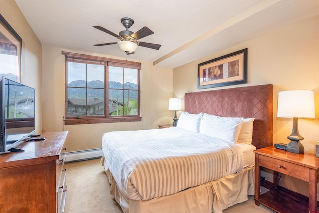 24 Sheol St Unit 202, Durango, CO 81301 - bedroom with a baseboard heating unit, light carpet, a mountain view, and ceiling fan