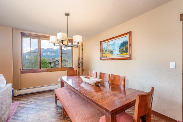 24 Sheol St Unit 202, Durango, CO 81301 - dining room featuring baseboard heating, a chandelier, wood finished floors, and a mountain view