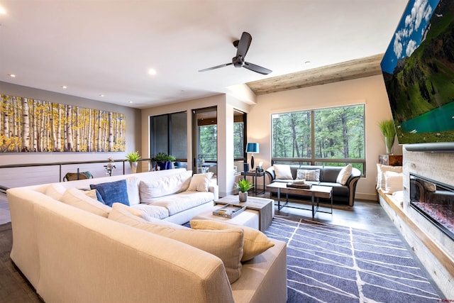 928 Twin Buttes Ave, Durango, CO 81301 - living area featuring recessed lighting, a glass covered fireplace, ceiling fan, and wood finished floors