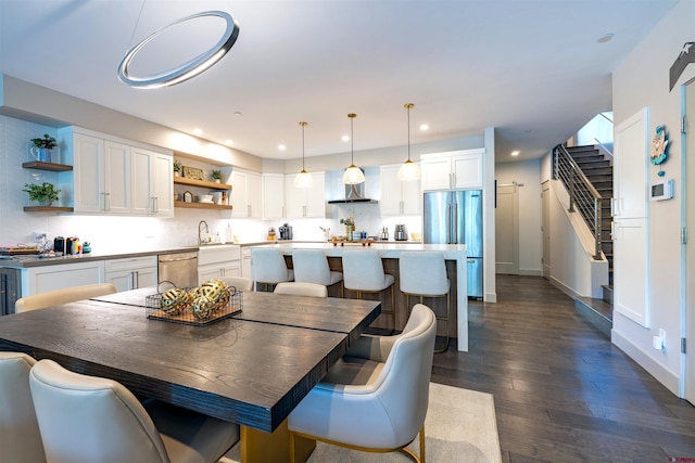 928 Twin Buttes Ave, Durango, CO 81301 - dining room featuring dark wood-style flooring, recessed lighting, and stairs