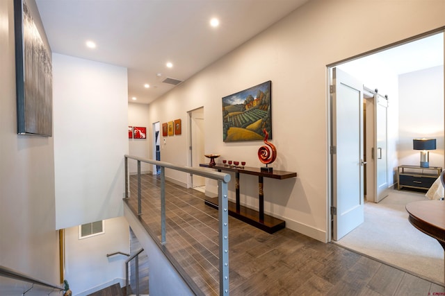 928 Twin Buttes Ave, Durango, CO 81301 - hall featuring wood finished floors, an upstairs landing, recessed lighting, and a barn door