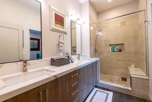 928 Twin Buttes Ave, Durango, CO 81301 - full bathroom with a shower stall, double vanity, and wood finished floors