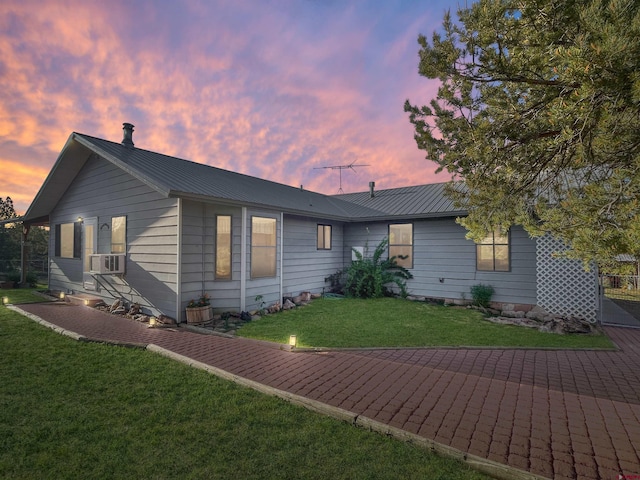 14245 Rd 21, Cortez, CO 81321 - single story home with cooling unit, a front lawn, and a metal roof