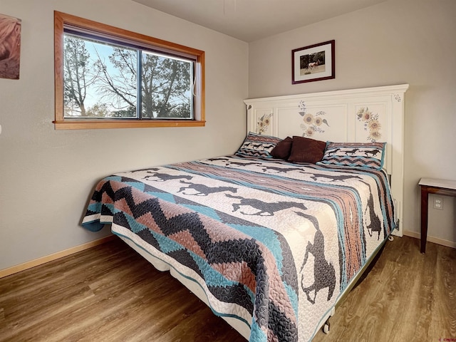 14245 Rd 21, Cortez, CO 81321 - bedroom with wood finished floors and baseboards