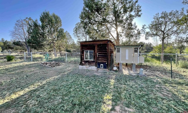 14245 Rd 21, Cortez, CO 81321 - fenced backyard featuring an outdoor structure and view of wooded area