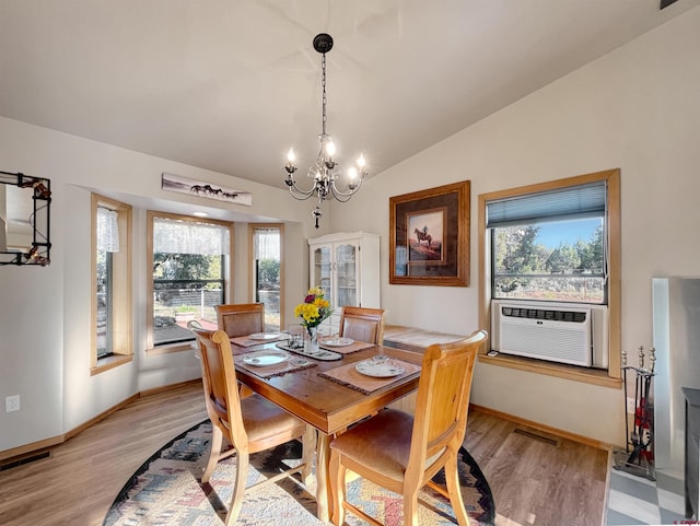 14245 Rd 21, Cortez, CO 81321 - dining area with plenty of natural light, light wood finished floors, a chandelier, and vaulted ceiling