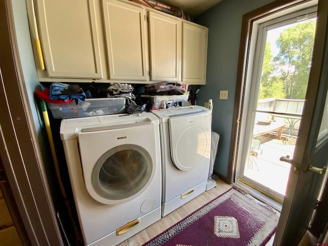 274 Tobin Ln, Gunnison, CO 81230 - laundry room with cabinet space, washing machine and dryer, and light wood-type flooring