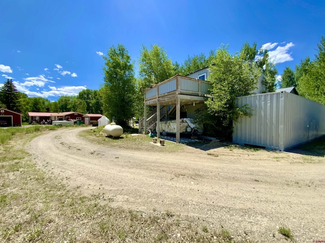 274 Tobin Ln, Gunnison, CO 81230 - view of yard featuring stairs, a deck, and driveway