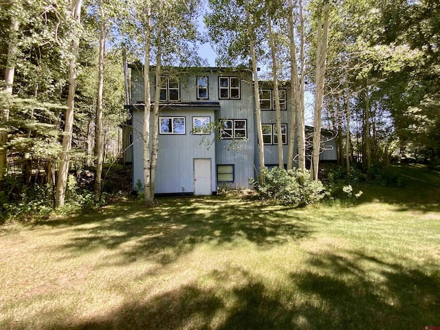 274 Tobin Ln, Gunnison, CO 81230 - rear view of house featuring a lawn
