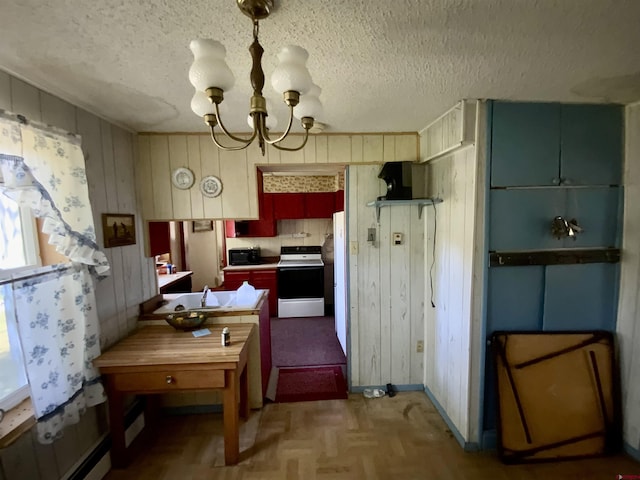 274 Tobin Ln, Gunnison, CO 81230 - kitchen with electric range, a chandelier, wooden walls, stainless steel microwave, and a textured ceiling