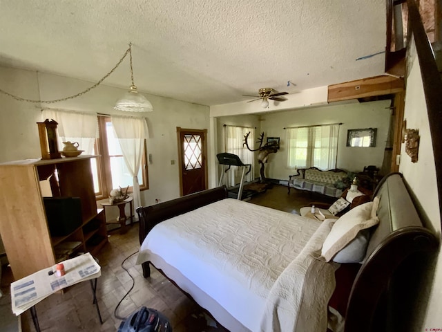 274 Tobin Ln, Gunnison, CO 81230 - bedroom featuring a textured ceiling, a ceiling fan, and wood finished floors