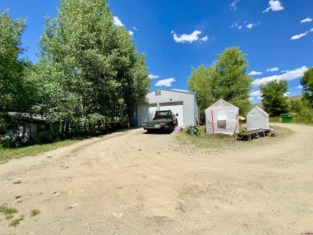 274 Tobin Ln, Gunnison, CO 81230 - view of front facade with a detached garage and an outdoor structure