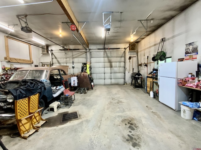274 Tobin Ln, Gunnison, CO 81230 - garage with freestanding refrigerator and a garage door opener