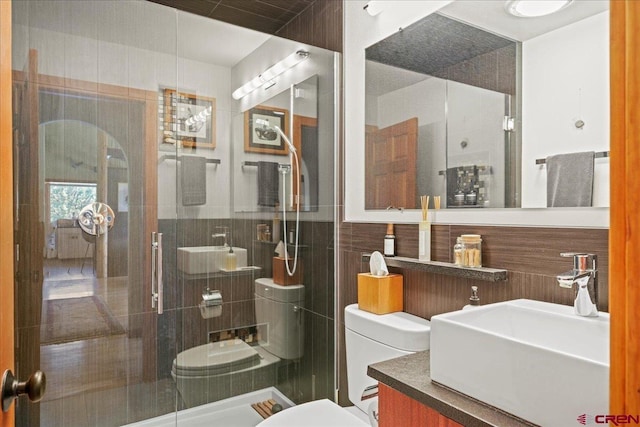 122 Juniper Rd, Ridgway, CO 81432 - bathroom featuring vanity, tile walls, and a stall shower