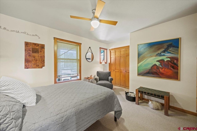 122 Juniper Rd, Ridgway, CO 81432 - bedroom featuring light colored carpet, ceiling fan, and a closet