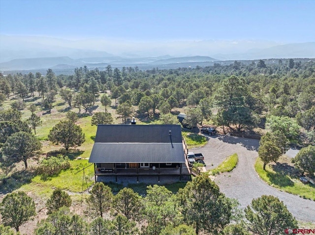 122 Juniper Rd, Ridgway, CO 81432 - aerial view of property and surrounding area featuring a mountainous background and a forest
