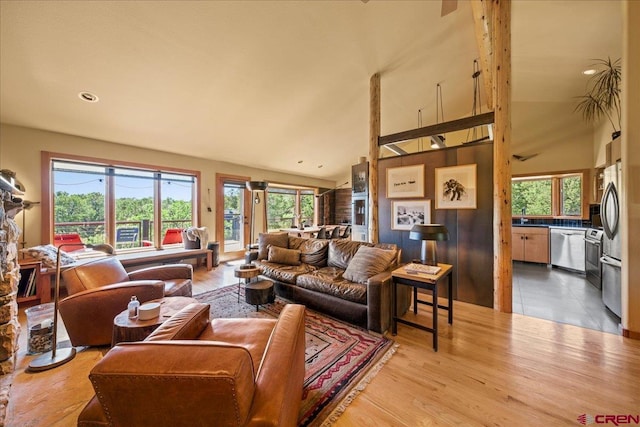 122 Juniper Rd, Ridgway, CO 81432 - living area with healthy amount of natural light, recessed lighting, light wood finished floors, and high vaulted ceiling