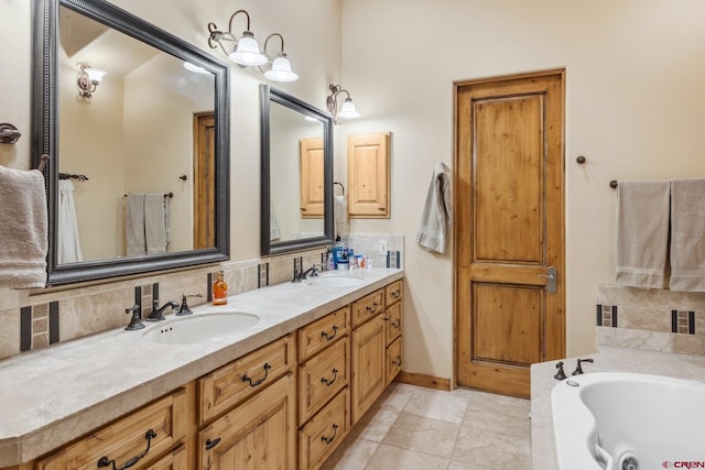 404 Benchmark Dr, Mountain Village, CO 81435 - bathroom featuring double vanity, a bath, and backsplash