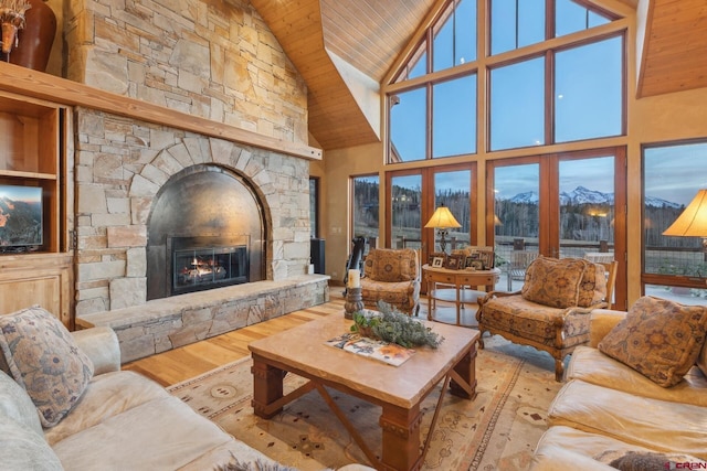 404 Benchmark Dr, Mountain Village, CO 81435 - living room featuring wooden ceiling, high vaulted ceiling, a fireplace, wood finished floors, and a mountain view