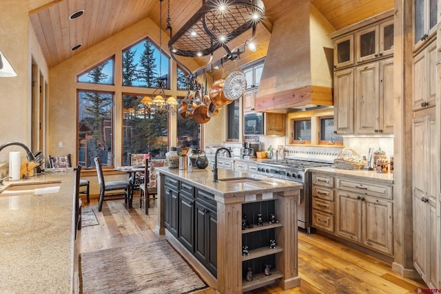 404 Benchmark Dr, Mountain Village, CO 81435 - kitchen featuring high end stainless steel range, high vaulted ceiling, wooden ceiling, built in microwave, and custom exhaust hood