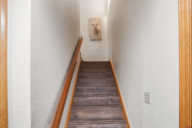 50827 N 550th Hwy Unit 329, Durango, CO 81301 - stairway featuring a textured wall and wood finished floors