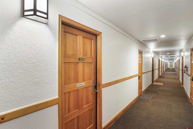 50827 N 550th Hwy Unit 329, Durango, CO 81301 - hallway with dark carpet, attic access, and recessed lighting