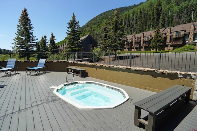 50827 N 550th Hwy Unit 329, Durango, CO 81301 - view of pool featuring an in-ground hot tub, a deck with mountain view, and a forest view
